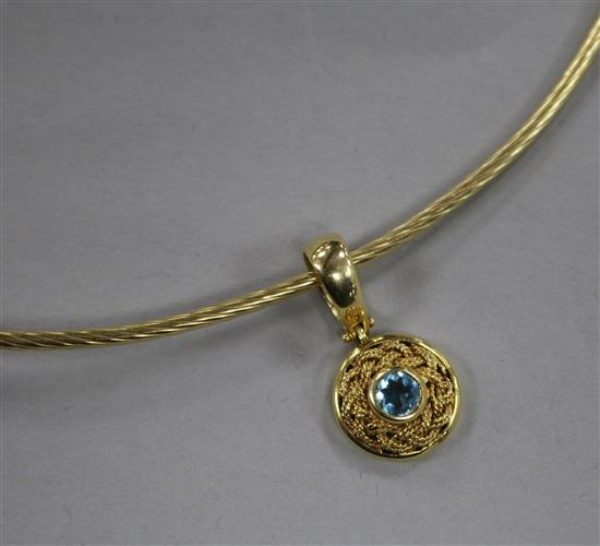 A 14ct gold and blue topaz pendant on a 14ct gold necklet.